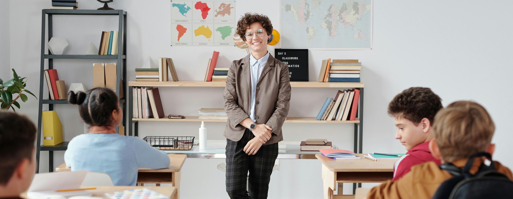 teacher stands in front of her class