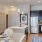 open kitchen with island and dining area at District at Memorial Apartments in Houston