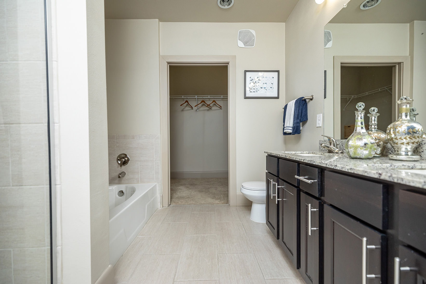 Bathroom tub in bathroom with walk-in closet