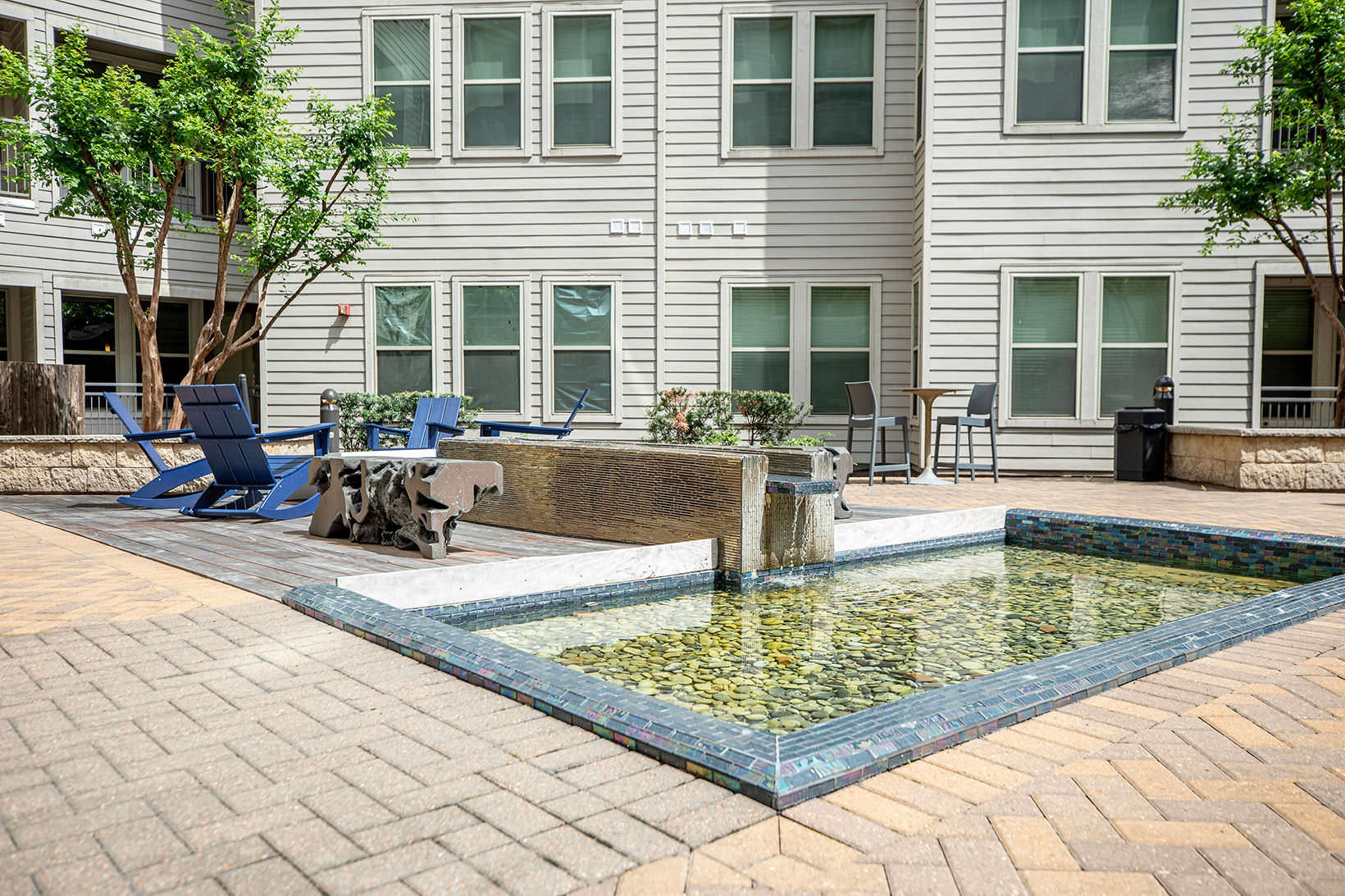 Courtyard benches in courtyard next to reflecting pool