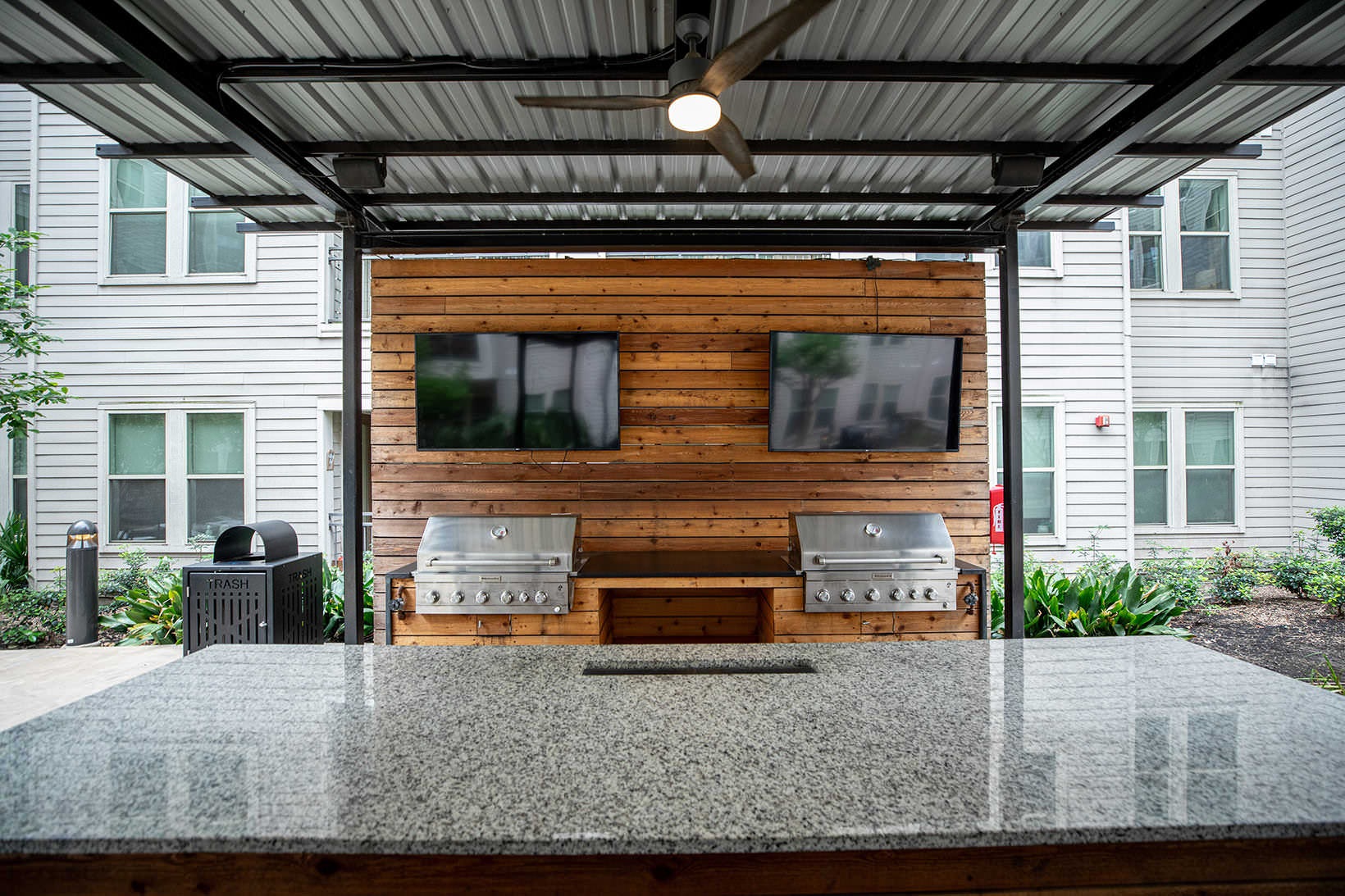 Grills large island facing grills and wall mounted tvs