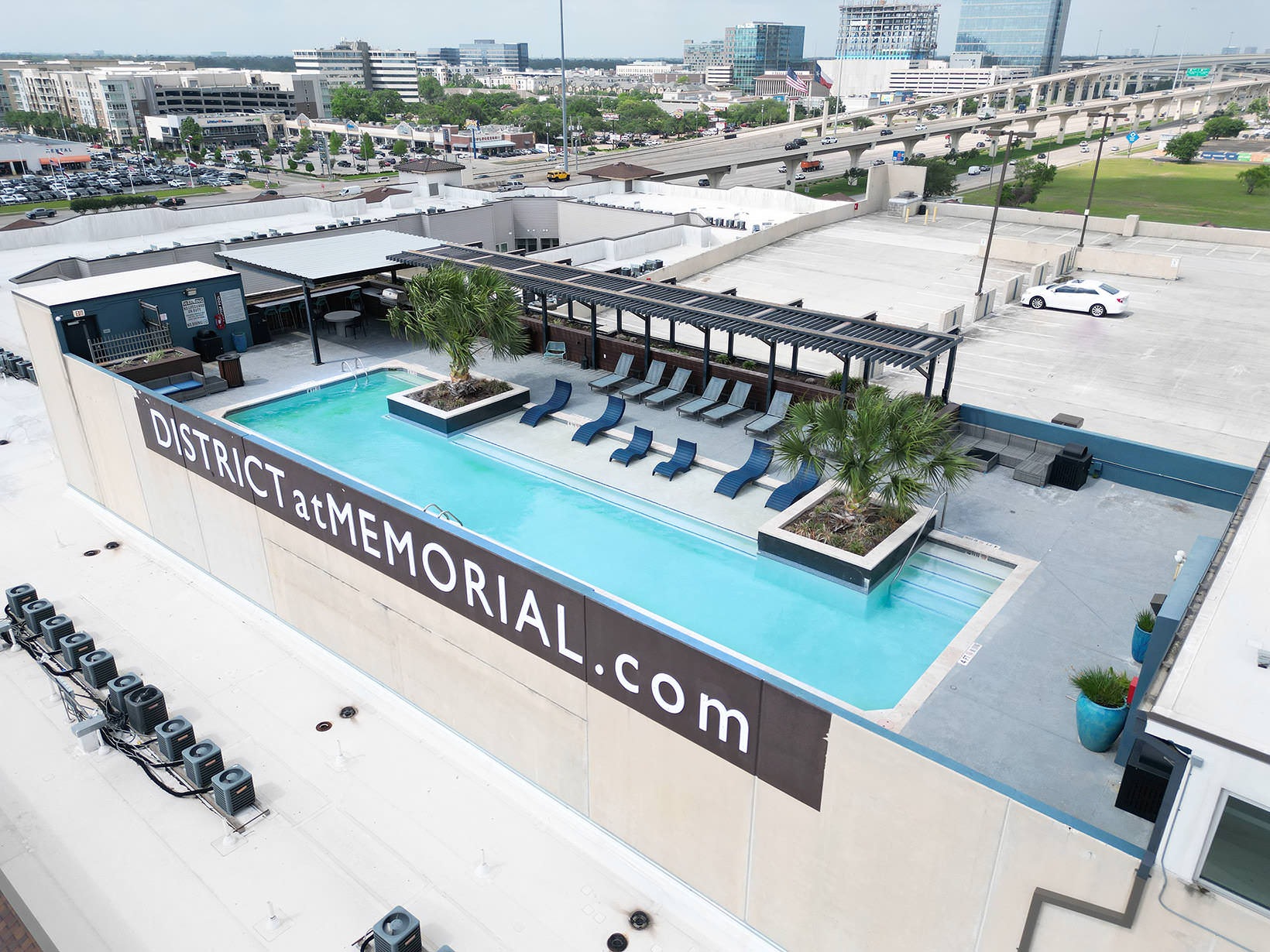 Rooftop Pool rooftop pool with in-pool lounge chairs