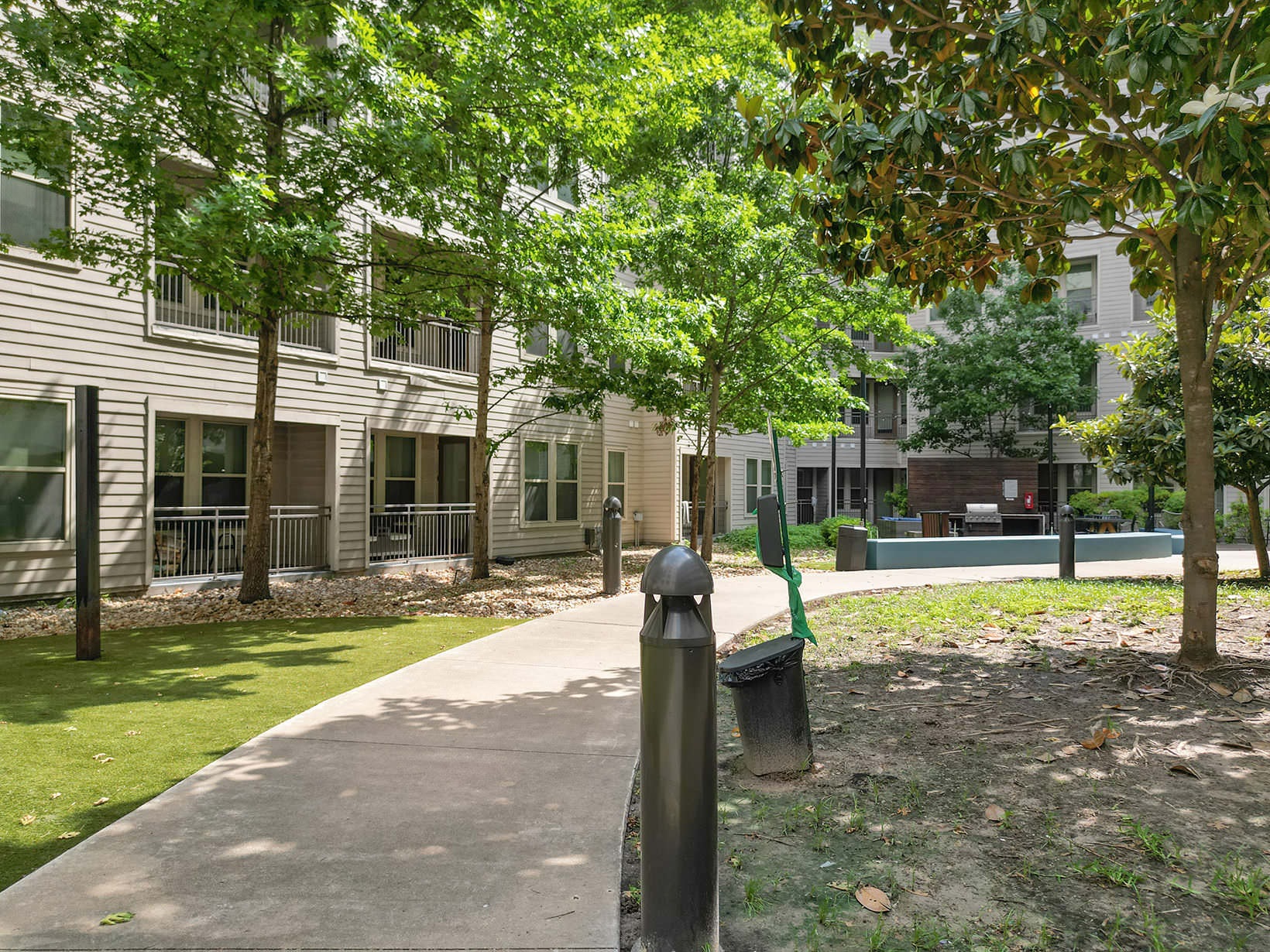 Walking Path tree shaded walking path and outdoor grills